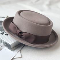 Hat new womens autumn and winter Japanese flat top hat wool curled short along the age-reducing concave shape Korean version of the tide street shot