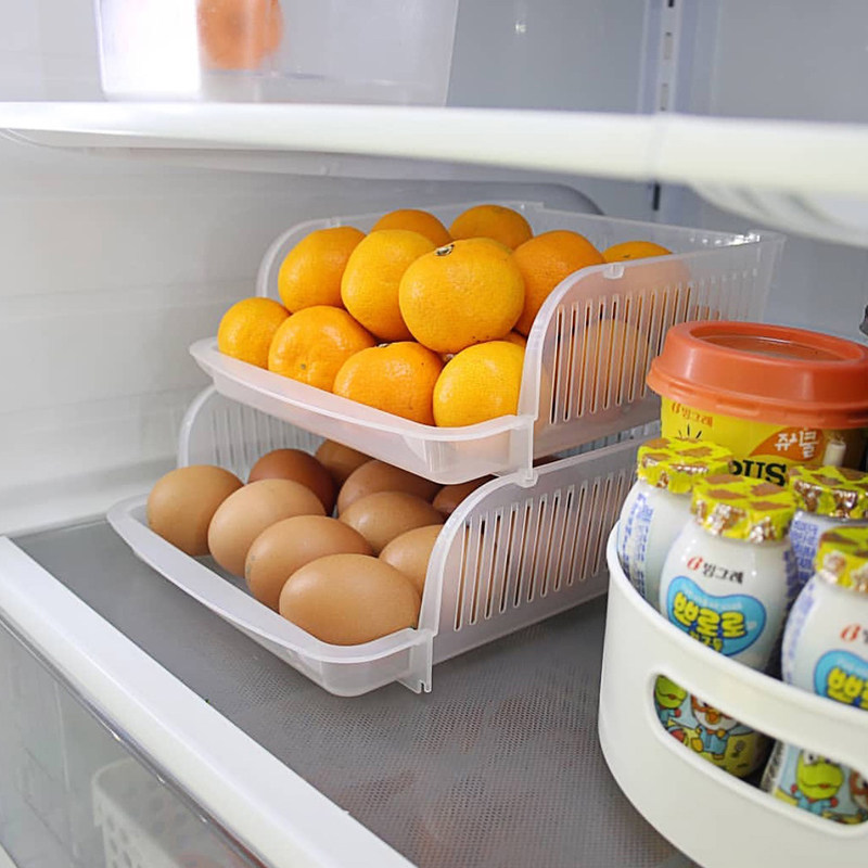 The rice refrigerator contains basket of Japanese imported transparent vegetable fruit and cooking basket can be superimposed