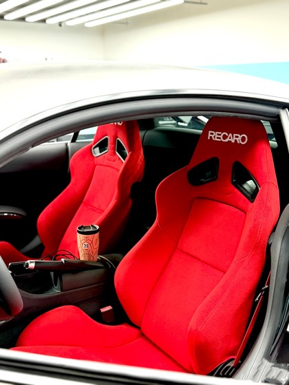 Red Recaro Sr7 Gk100 Car Seat Modified into a Racing Seat with Strong Side Support and Wrap-Around Design