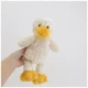 Желтая кукла утенка