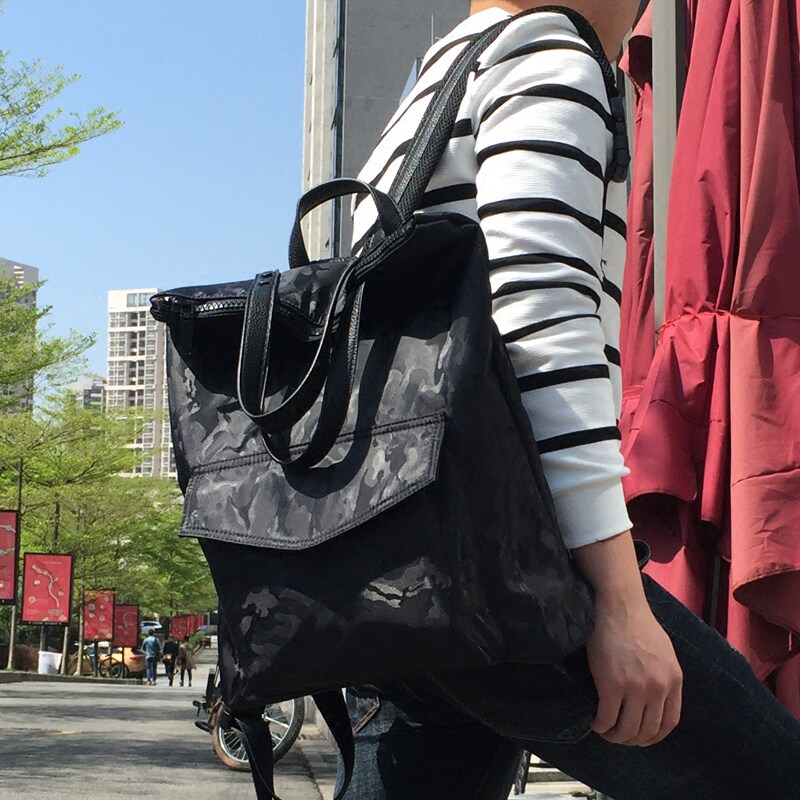 夏季潮流迷彩背包男韩版双肩包防水运动大学生书包女手提包两用包