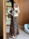 French retro floral suspender dress for women summer 2026 new seaside vacation temperament long skirt suit