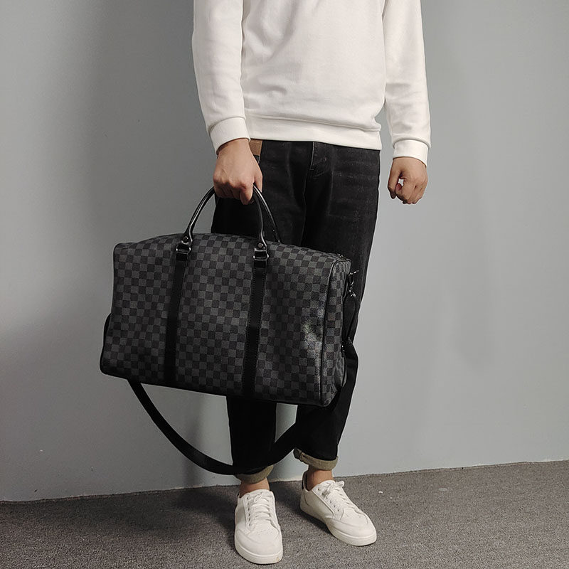 New Korean version of male and female hand-held large-capacity short-distance travel luggage bag waterproof boarding trend luggage bag