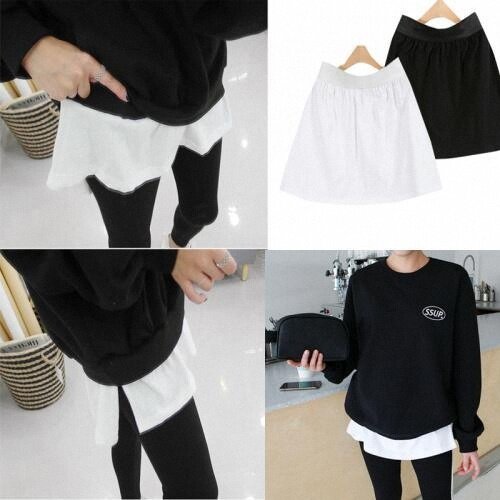 The white matching T-shirt stacked inside the hem of the sweater underpinchers wears the inside lap mini short skirt half-body dress.