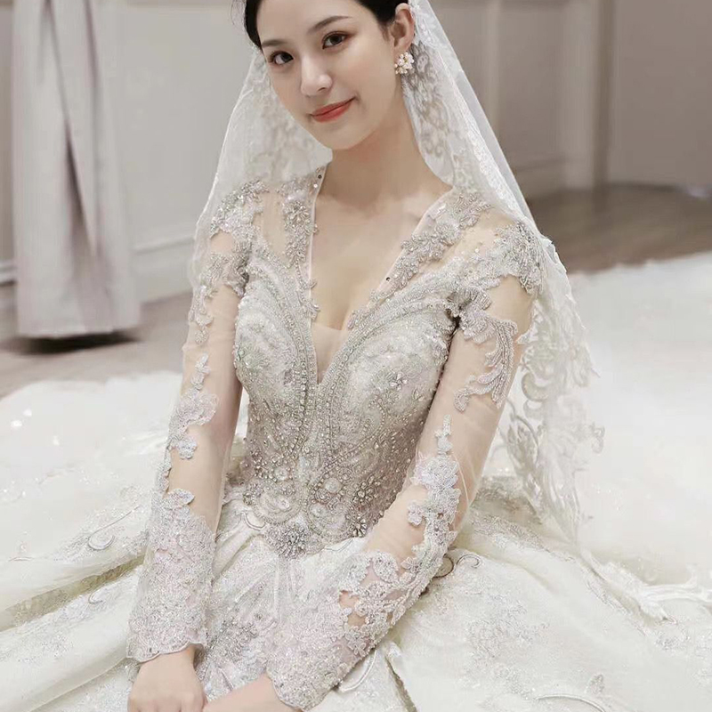 The 2022 new long sleeve wedding dress bride temperament court luxury dream shade arm luxury dragger