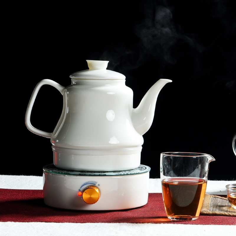 The cabinet household contracted dehua white porcelain tea set ceramic water boiling tea is tea stove water boiler heating furnace The teapot