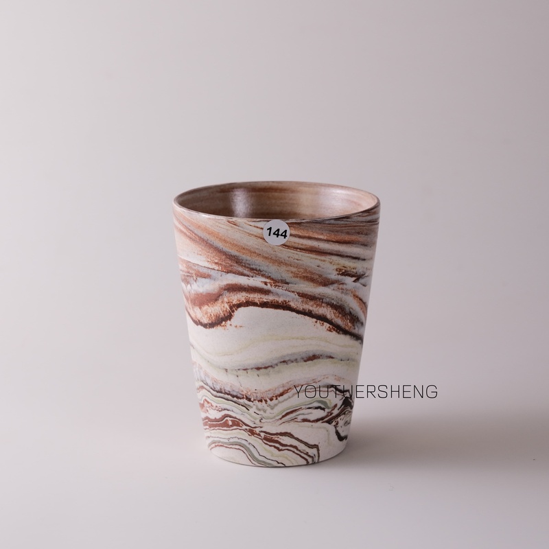 Handcrafted by a Niche Studio in Jingdezhen, China, These Coffee Cups Feature a Unique Twisted-Edge Design and Are Made of Warm-Toned Ceramic