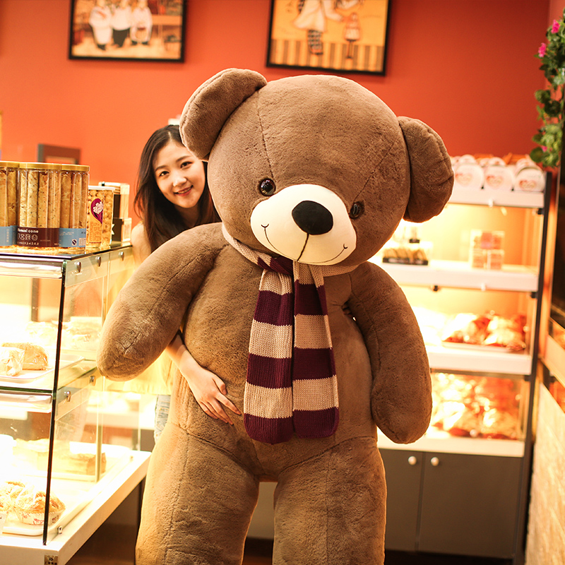 girl hugging big teddy bear