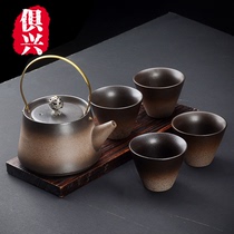 A complete set of kung fu tea set a pot of four cups of hand-made coarse pottery travel tea set lifting pot dry bubble plate pot bearing gift tea set