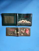 Two of the old plastic wallets of the Wenge Period