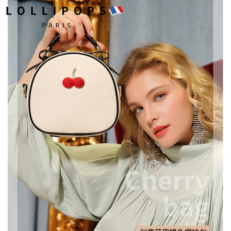 Leather women's round cake bag 2022 new trend 2021 light luxury spring and summer messenger bag fashion hand-held one-shoulder small round bag