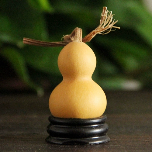 Имитация красного дерева с твердым деревянным круговым текстом играет маленькая тыква дно яйцо.