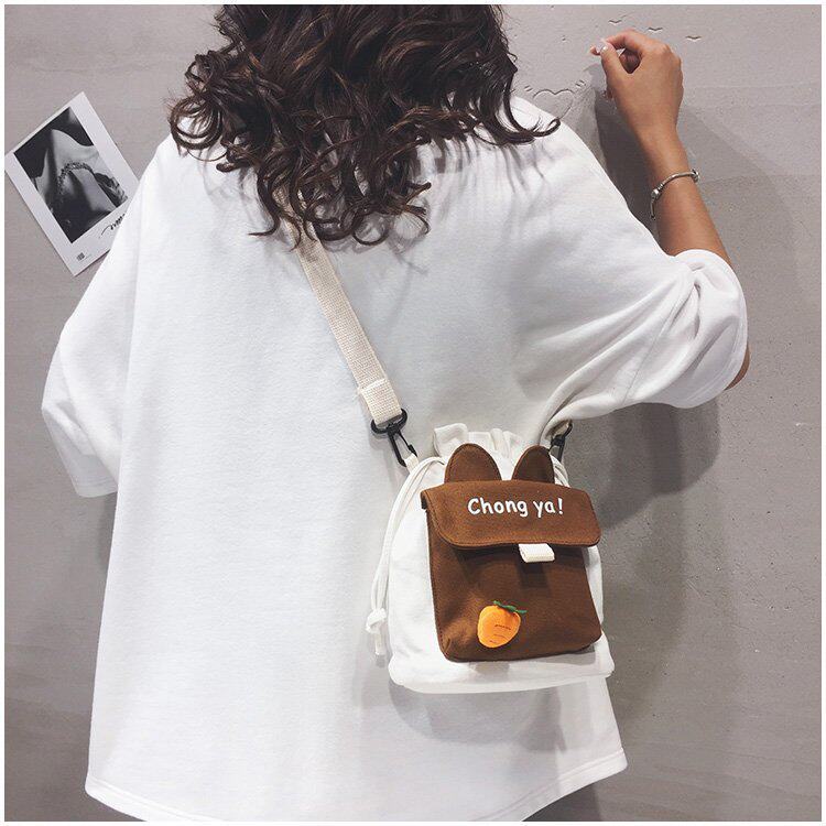 Детская сумка на ремне 春夏新款学生帆布小包包甜美淑女撞色单肩包可爱潮挂件抽绳斜挎包 Jifanpaul