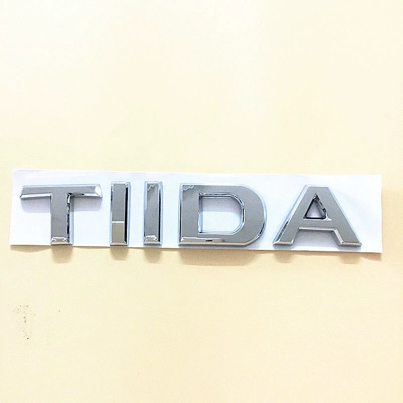 Nissan Tiida Tiida mới và cũ trọn bộ logo xe TIIDA phía trước giữa lưới logo phía sau hộp đuôi phía sau Logo logo chữ tiếng anh decal dán xe ô to lô gô xe hơi 