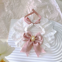 Слюнявчик из жемчуга с бантиком