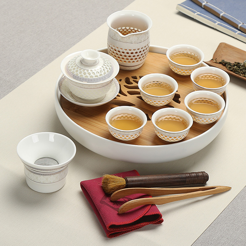 Really sheng glass and exquisite hollow out of a complete set of tea set porcelain ceramic tea tray was water bamboo kung fu tea cup