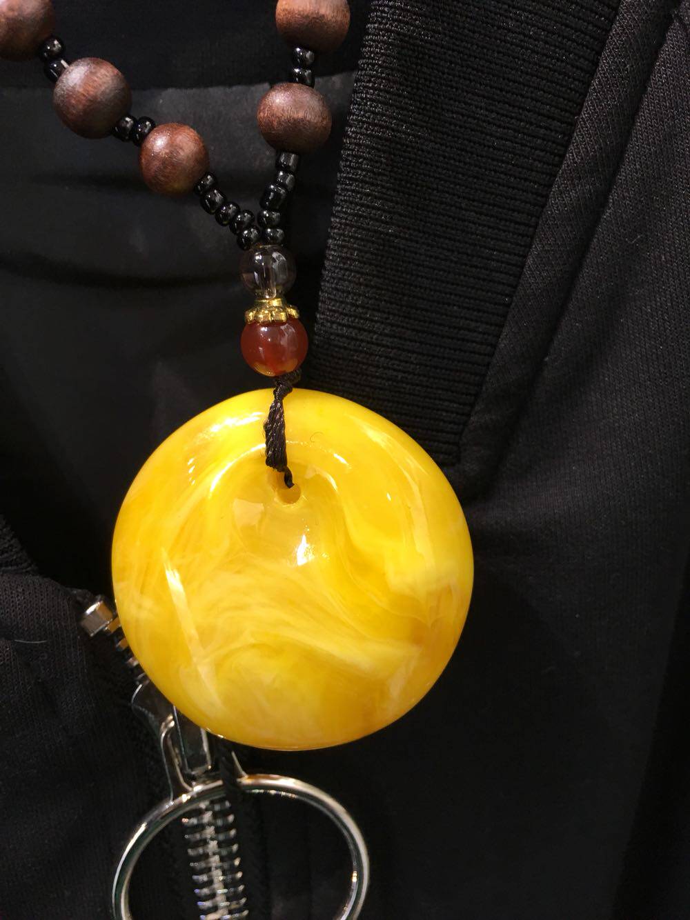 Honey Wax Hanging Necklace with a necklace