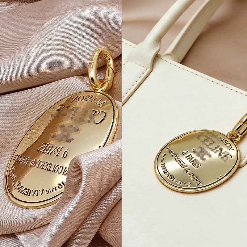 European and American French-Style Minimalist Gold Oval Metal Bag Pendant with Engraved Letters, Commemorative Bag Keychain Pendant