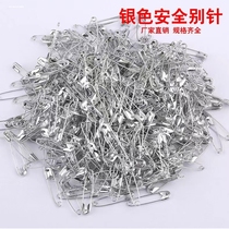 Old-fashioned childrens safety pins to fix the waistband of clothes and trousers modified into small brooches large and small paperclips and pins exquisite