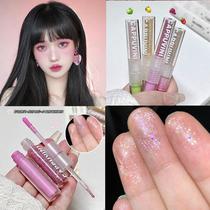 A multi-purpose double-ended liquid eyeshadow with ultra-shimmering grape purple red yellow and green color dopamine makeup for a playful look