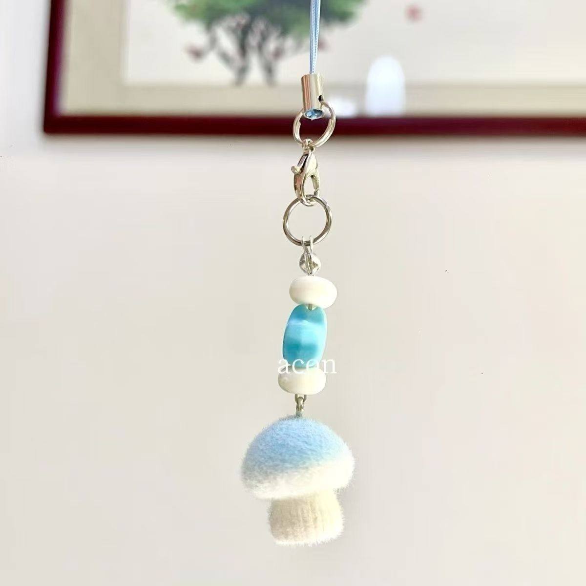 Korean-style flocked bag charm, QQ blue mushroom phone charm, cute girly keychain, trendy dreamy style accessory.