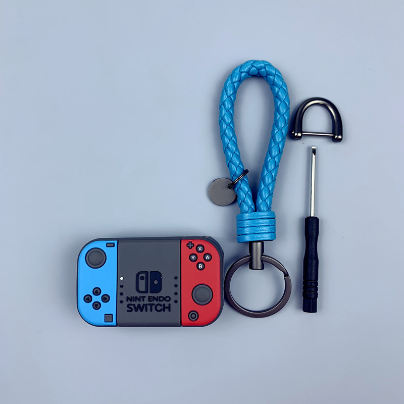 Suitable for Audi Q3 key cover A3 chain A6 shell A7A8 cartoon cute game machine car folding key chain shell female