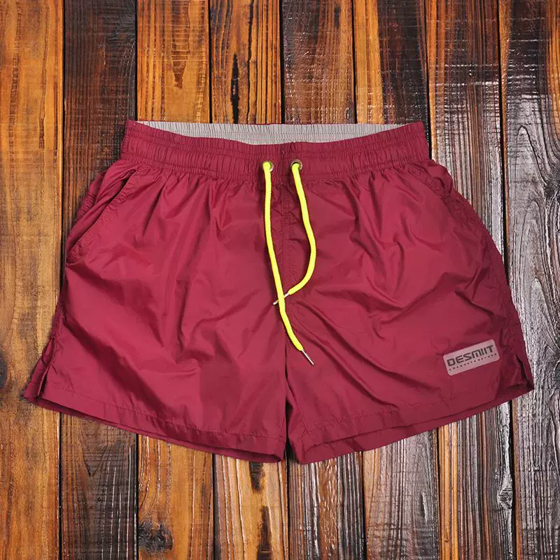 Quần short đi biển nam màu nóng hàng giả quần đi biển có lớp lót bên trong, quần short bơi ba điểm thể dục thể thao nam nhanh khô - Quần bãi biển
