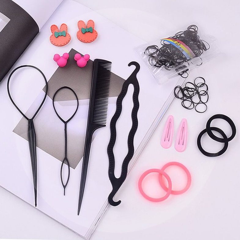 Little girl zagher wearing hair deviner fried braid, cropped hair and hair hook and baby bound baby comb girl