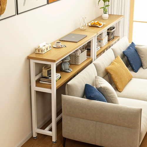 Шкаф для хранения в задней части стойки для заднего хранения дивана находится рядом со стеной и кроватью края кровати. Шкаф для хранения у кровати находится за зазором кровати.