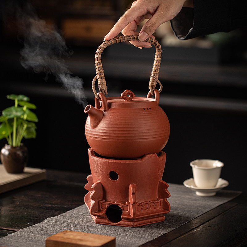 Tea stove, butter, household lifting kettle, clay pot, ancient method, open fire charcoal charcoal stove, outdoor camping, making tea around the stove