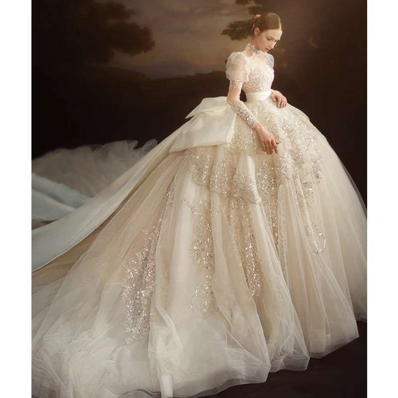 Long sleeve light wedding dress 2021 new bridal high-end heavy industry luxury big drag tail champagne color premium sense main yarn 2022