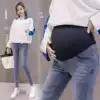 2021 new maternity pants spring and Autumn pregnant women jeans belly long pants tide mother wear burrs outside nine points of holes