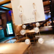 Korean temperament net red length pearl earrings in fashion autumn and winter super fairy round face with thin earbuds with female pure silver needle ear nails