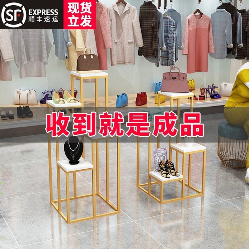 Clothing store window decoration high and low shoe bag display stand golden creative net red free installation Nakajima flow table