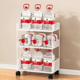 Небольшая книжная полка рядом со столом может переместить колесо, чтобы приземлиться на офисный стол.