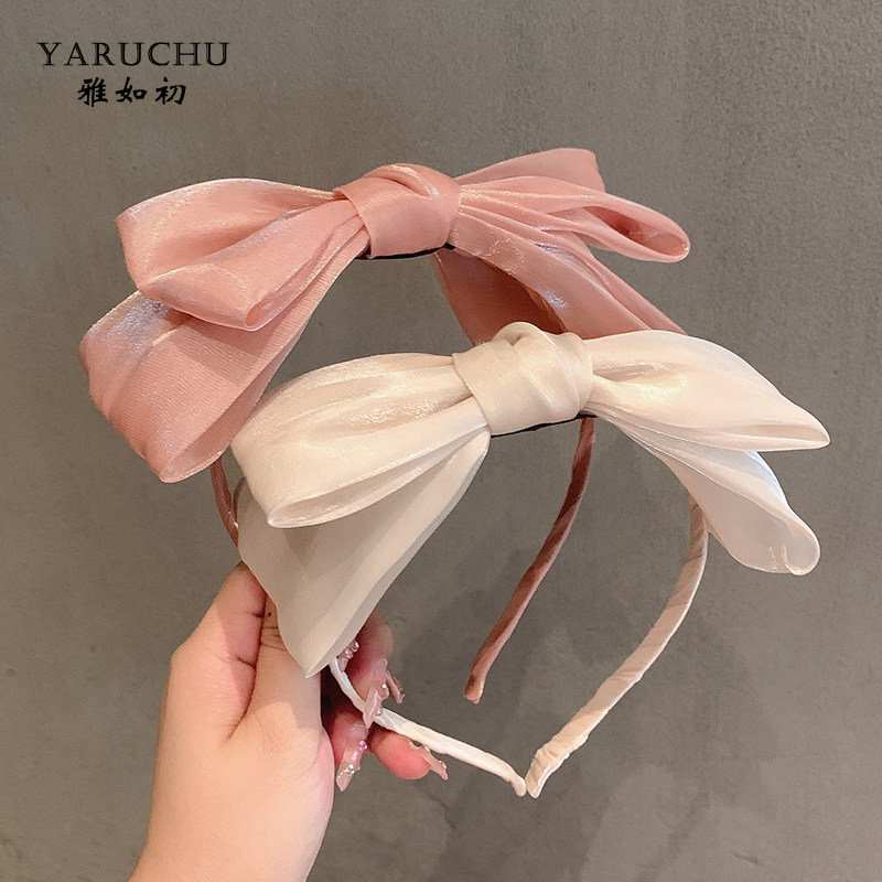 Elegant and graceful Korean double-layered bow headband for women, a popular style for summer 2022.