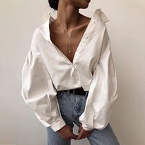 Spring Summer 2021 lantern sleeve shirt womens autumn European and American style womens wear design sense niche sexy white long-sleeved top