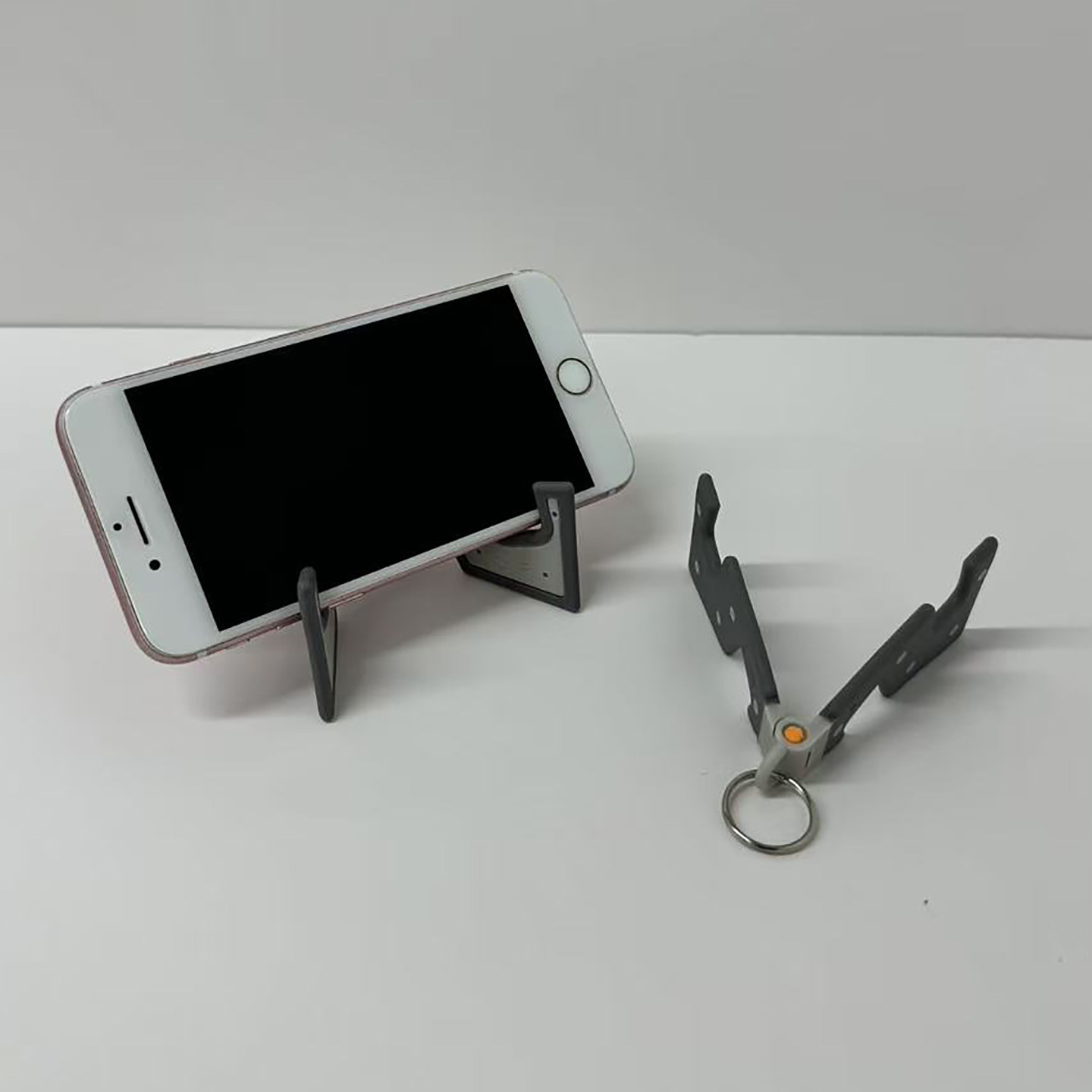 Desktop phone stand, compact and portable tablet bedside support frame, foldable and simple living room fixed frame for lazy people