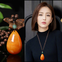 Star style old beeswax pendant amber water drop necklace women's light luxury niche summer sweater chain 2026 new hot style