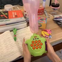 Blowing balloons and whack-a-mole toys press and push childrens educational training to break through levels handheld finger game console to decompress