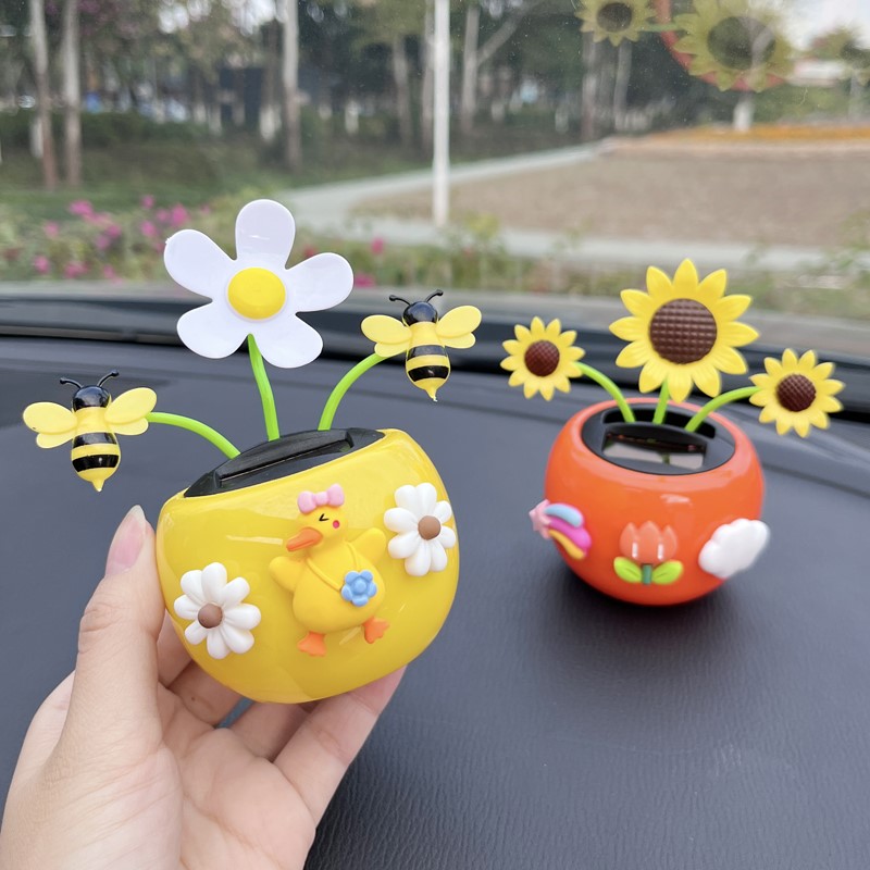 Car furniture new creative cute solar car on board console shaking head decoration solar flower