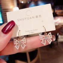 Ear decoration Korean butterfly knot pearl small ear pendant sweet and beautiful ear nail earrings female trend goddess
