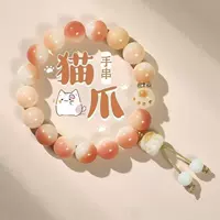 Пьяный розовый браслет с кошачьими когтями перед цветами