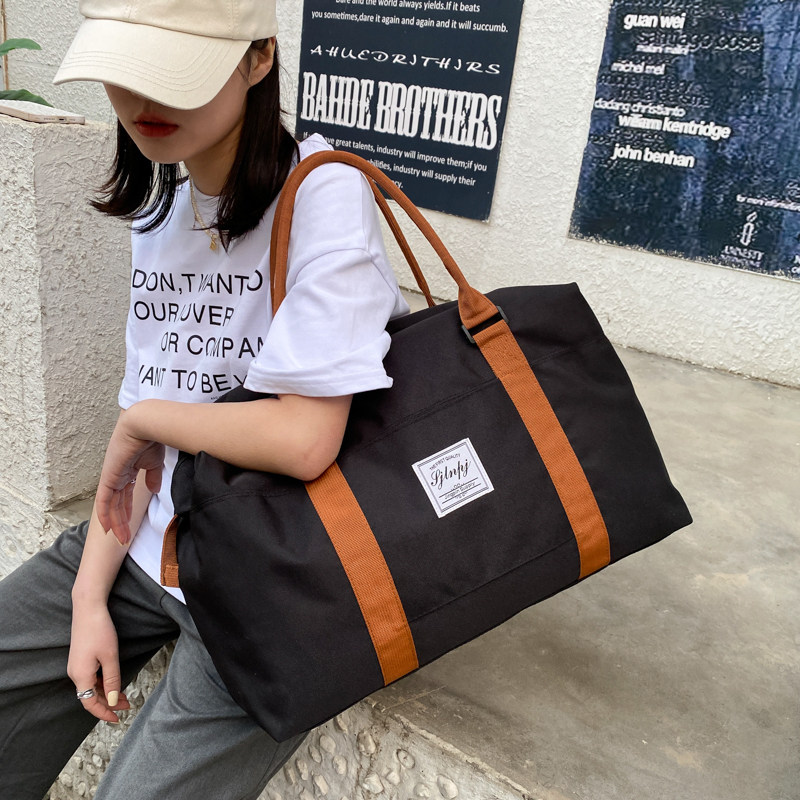 Large-capacity portable travel bag women's business travel luggage bag waterproof storage bag short-distance production oblique shoulder storage bag