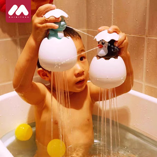 Bathing little duck plays in water and squirts dinosaur eggs