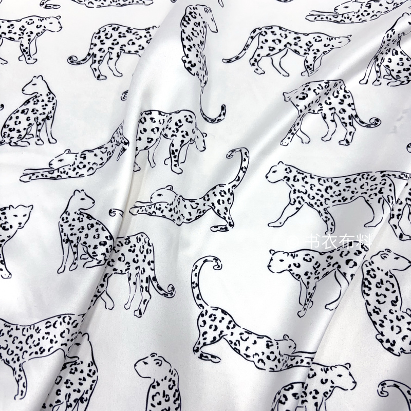 Thin Drapey White Base with Black Cheetah Print Faux Silk Satin Fabric for Shirts, Cheongsams, and Camisoles