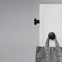 European light luxury wabi-sabi style wall black hole stone hook designer bedroom living room creative art coat hook