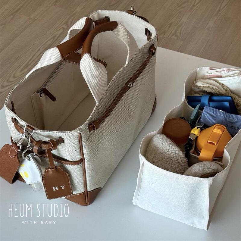Korea ins Mommy Bag, Lightweight Tote Bag for Going Out, Large Capacity, Multi-Functional Canvas Crossbody Mother and Baby Bag Korea ins Mommy Bag, Lightweight Tote Bag for Going Out, Large Capacity, Multi-Functional Canvas Crossbody Mother and Baby Bag