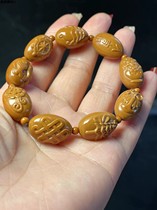 Olive stone carved eight auspicious seeds embossed womens bracelet
