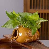 Fish tank filter earthen pot flowing water pouring bottle pouring can creative flowing water tank copper money grass flower pot fish tank flowing water circulation pendulum u